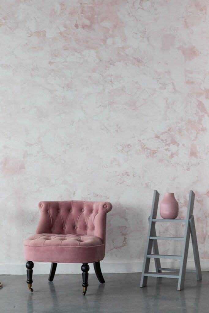 Pink blush textured venetian plaster feature wall in London with furniture in front of it