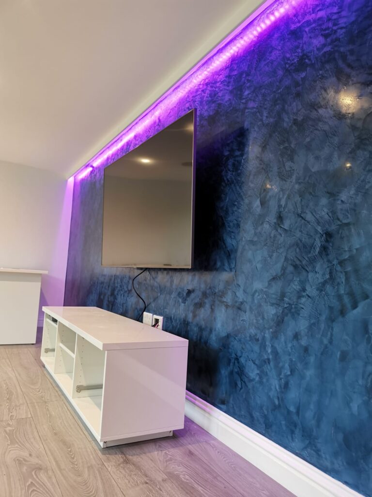 dark blue venetian polished plaster feature wall with L.E.D lighting in surrey